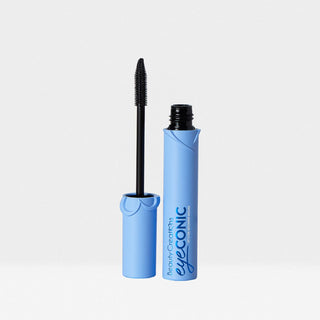 Blue mascara tube with black wand on a light gray background