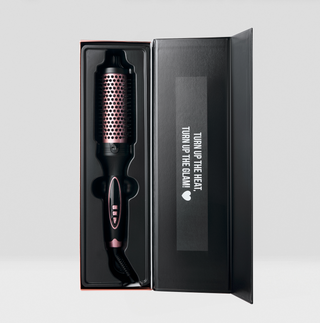 Hair styling tool in a black box with text on a light gray background