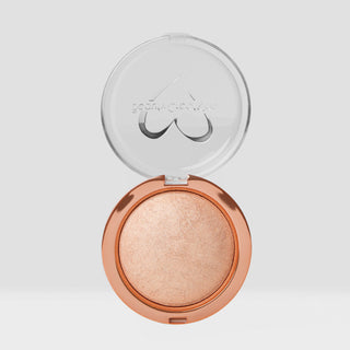 Compact powder with a clear lid on a light gray background. Shade is Moonlace Shimmer Veil Beauty Creations Face and Body Highlighter