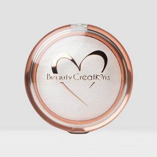 Closed Compact powder with 'Beauty Creations' logo on a light gray background. Shade is Pearlescent Shimmer Veil Beauty Creations Face and Body Highlighter