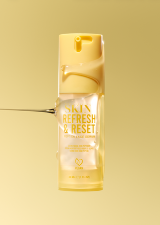 A bottle of Skin Refresh & Reset Cucumber Face Serum floating against a solid yellow background, with a droplet of serum dripping from the cap and another droplet shown as a graphic on the left.