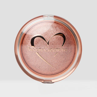 Compact makeup powder with a heart-shaped logo on a light gray background. Shade color is Rose Gold. Body and face highlighter.